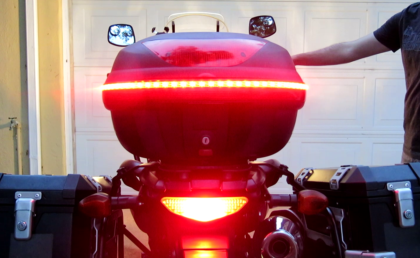 Rear view of motorcycle with brake lights illuminated